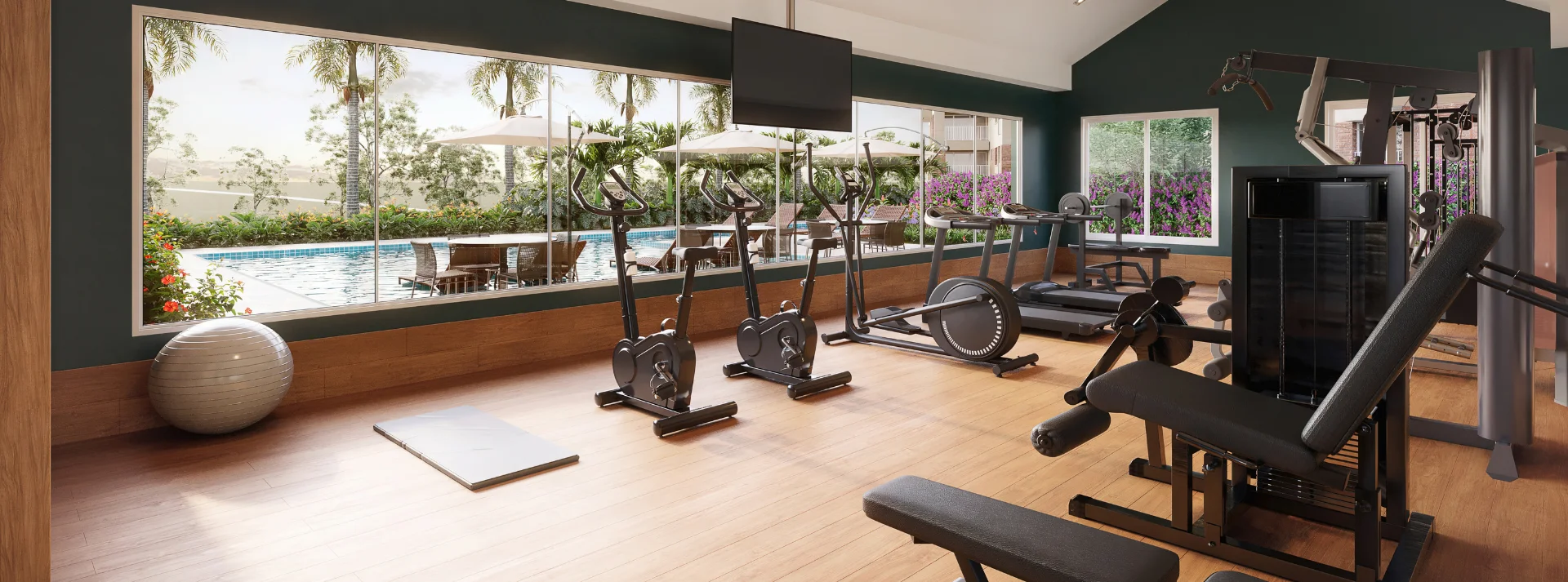 Academia com vista panorâmica da piscina através do vidro. Equipada com bike, esteira e leg press para um treino completo.